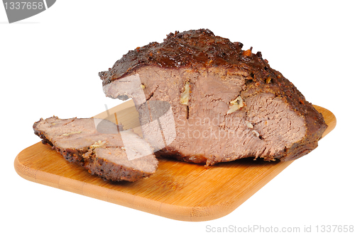 Image of Roast beef on a wooden board