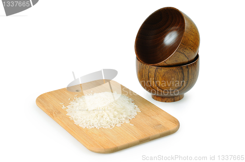 Image of Wooden bowls for rice. Handful of rice