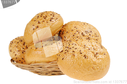 Image of Bun, topped with sesame seeds in a basket