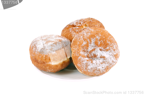 Image of Three donut on a saucer