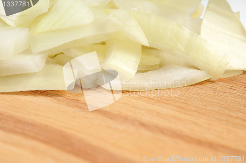 Image of Chopped onions on a wooden board