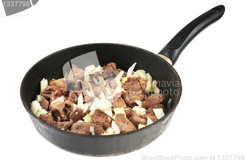 Image of Roasting pan with Meat and onion.