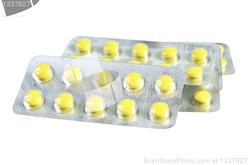 Image of Several packs of yellow pills