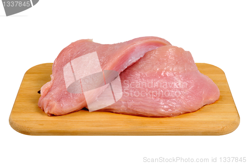 Image of Turkey meat on a wooden board