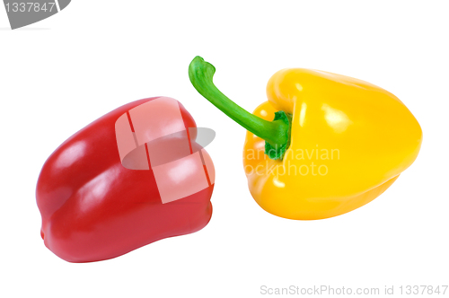 Image of Two peppers - red and yellow in a piquant position