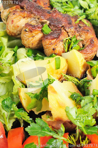 Image of Grilled meat and potatoes