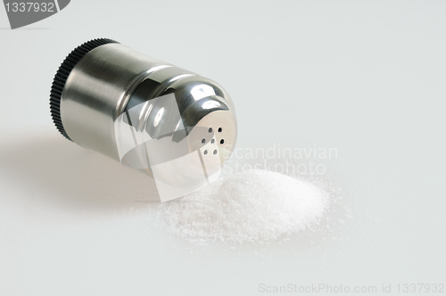 Image of Salt shaker and spilled salt