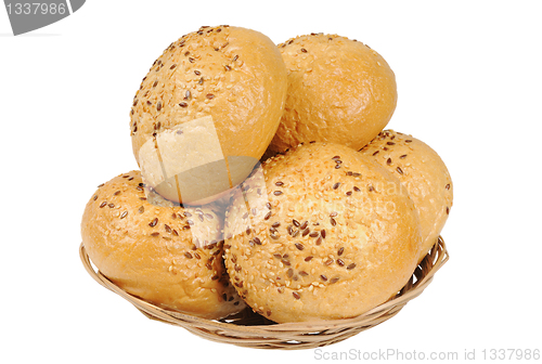 Image of Bun, topped with sesame seeds in a basket