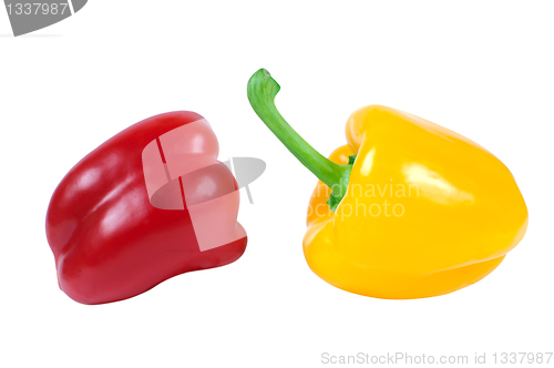 Image of Two peppers - red and yellow in a piquant position