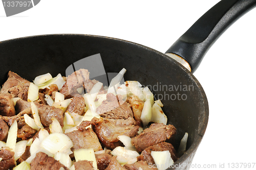 Image of Roasting pan with Meat and onion.