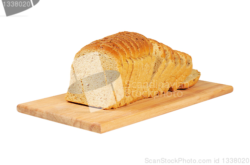 Image of Sliced bread on wooden board.