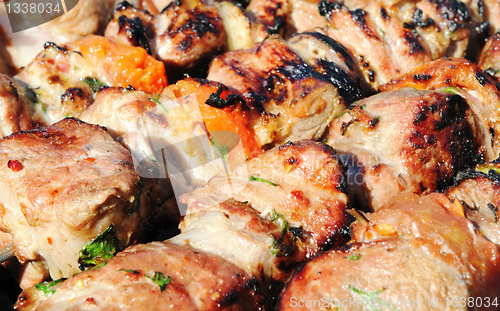 Image of Kebabs, threaded on a skewer and grill.