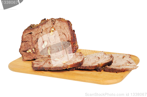 Image of Roast beef on a wooden board