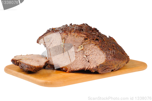 Image of Roast beef on a wooden board