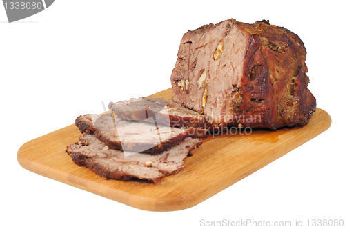 Image of Roast beef on a wooden board