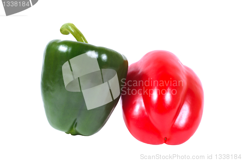 Image of Two peppers - green and red on a white background