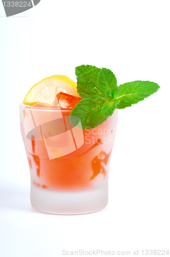 Image of Dessert - fruit jelly with lemon and mint leaves