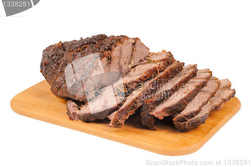 Image of Roast beef on a wooden board