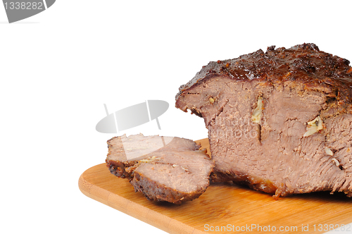 Image of Roast beef on a wooden board