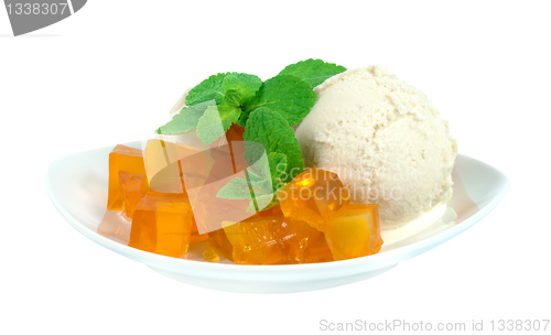 Image of Ice cream and jelly, decorated with mint leaves.