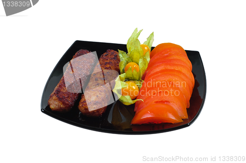 Image of Kebab with vegetable garnish