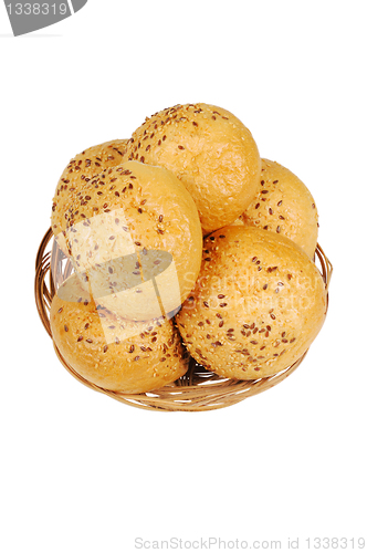 Image of Bun, topped with sesame seeds in a basket