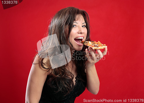 Image of Happy woman eating pizza