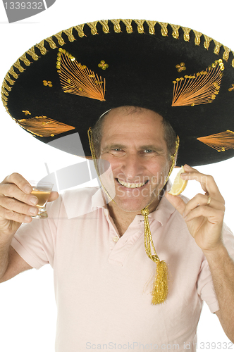 Image of middle age senior tourist male wearing Mexican somebrero hat dri