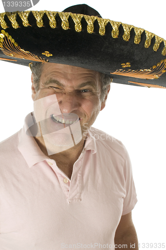 Image of middle age senior tourist male wearing Mexican somebrero hat