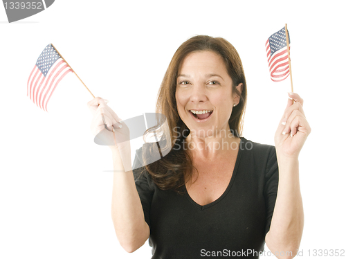 Image of happy woman waving patriotic American flags