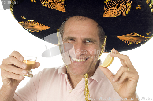 Image of middle age senior tourist male wearing Mexican somebrero hat dri