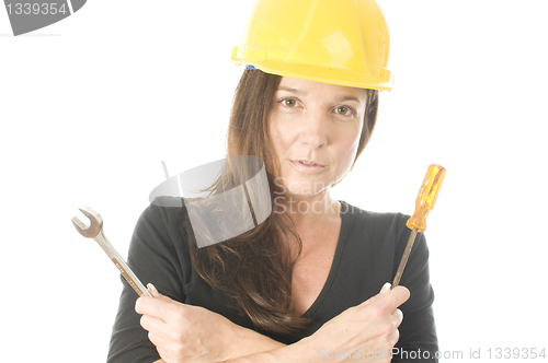 Image of female worker carpenter builder with tool belt and hard hat helm