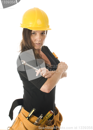 Image of female worker carpenter builder with tool belt and hard hat helm