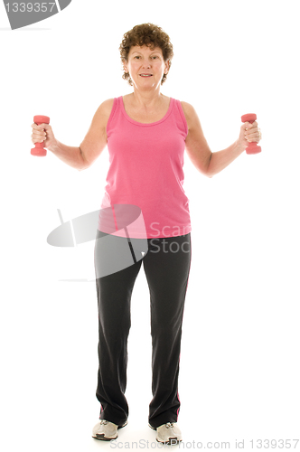 Image of senior middle age woman exercising with dumbbells 