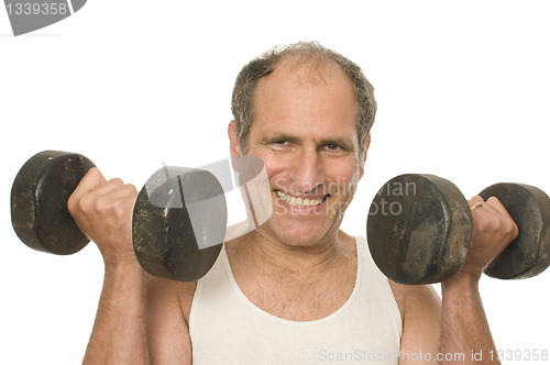 Image of middle age senior man working out with dumbbell weights