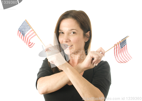 Image of happy woman waving patriotic American flags