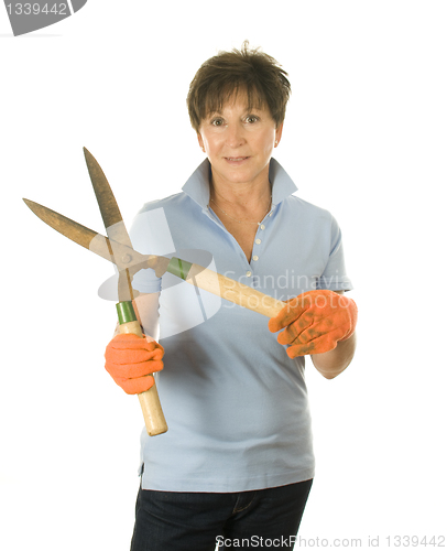 Image of cute middle age woman garden hand tool hedge trimmer shears