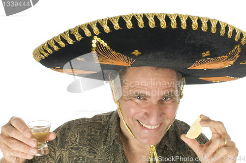 Image of middle age senior tourist male wearing Mexican somebrero hat dri