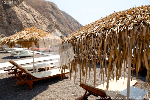 Image of Sunbeds in Perissa, Santorini, Greece