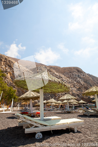 Image of Sunbeds in Perissa, Santorini, Greece