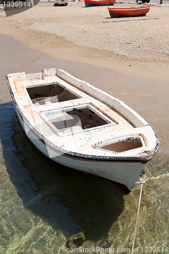 Image of White rowing boat in Mykonos, Greece