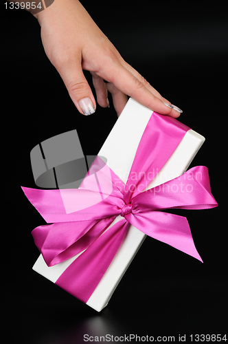 Image of Gift box with and woman's hand