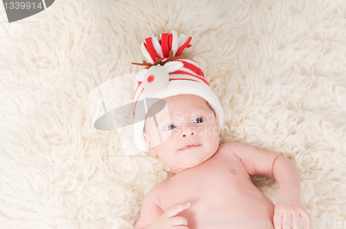 Image of Newborn baby in chritstmas hat