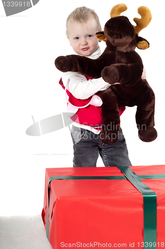 Image of Christmas toddler with presents
