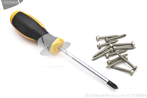 Image of Yellow screwdriver and screws