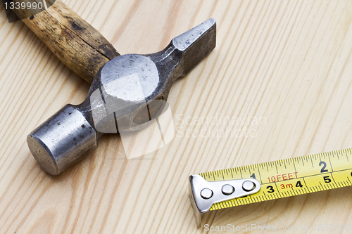 Image of Old hammer and tape measure