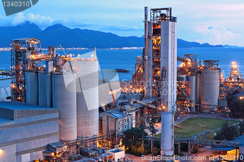 Image of cement factory at night