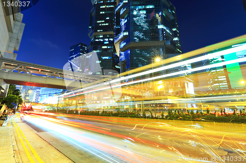 Image of car light trails in modern city