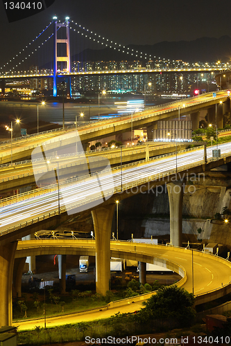 Image of reeway and bridge at night