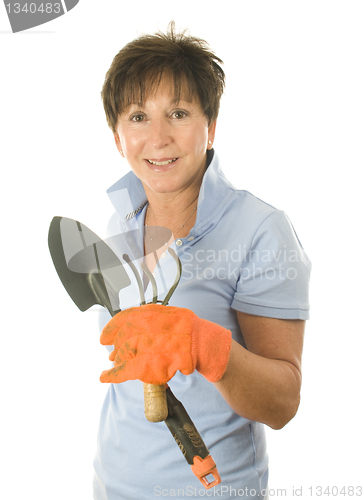 Image of cute middle age woman garden hand tools